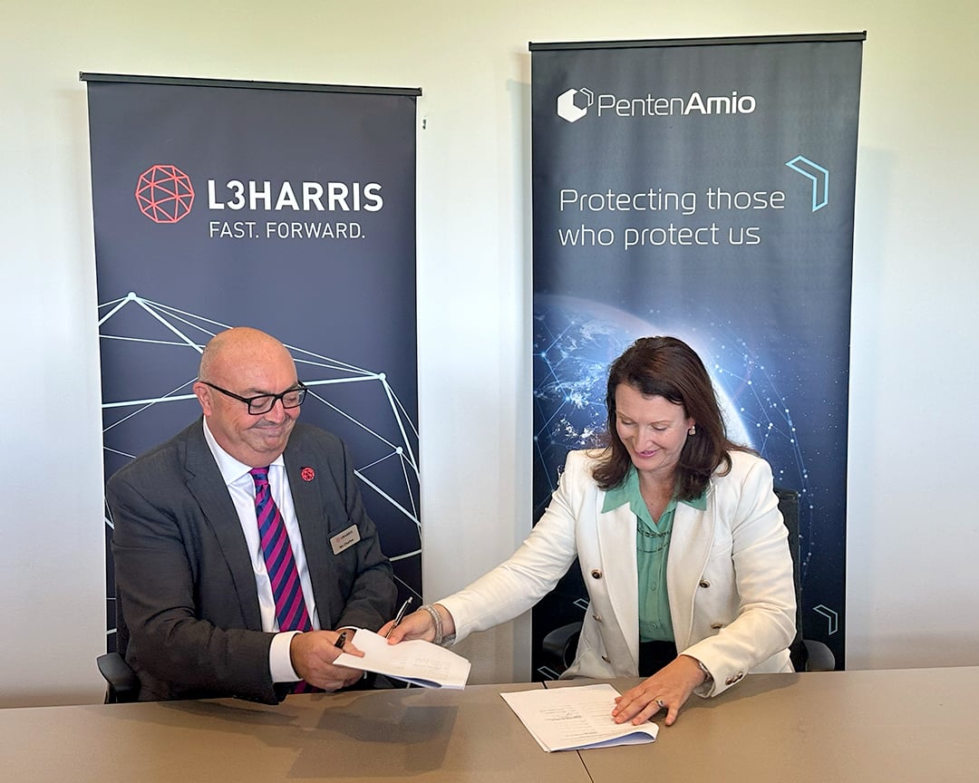 Ian Charles of L3Harris and Sarah Bailey of PentenAmio sign teaming agreement